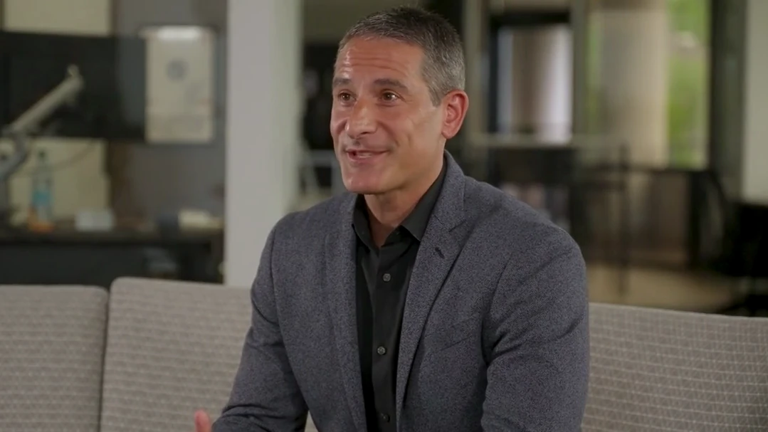 Dino Efthimiou, CEO and co-founder of Delta Wealth, smiling during the story video